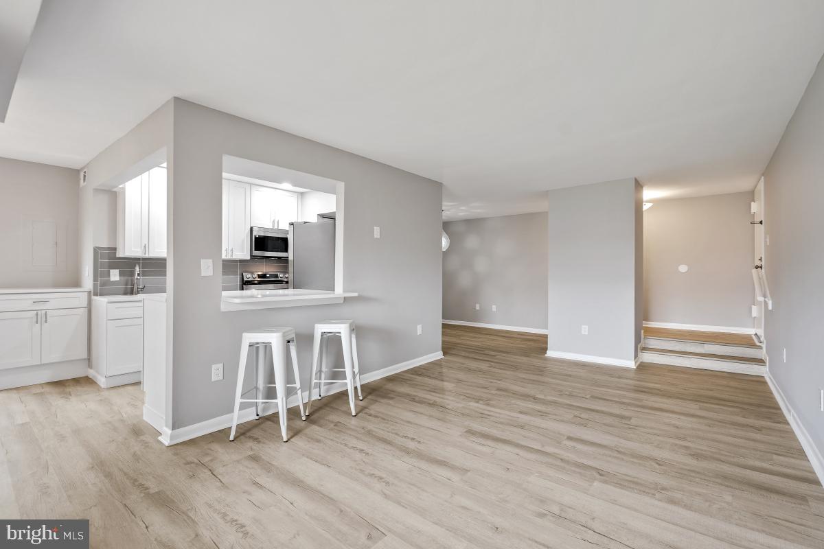 8007 Mandan Road, Unit 201 Greenbelt, MD 20770 - Photo 4 of 30 Custom kitchen with quartz counters.