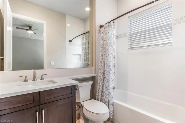 a bathroom with a sink a mirror and a toilet