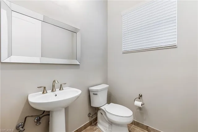 a bathroom with a tub a sink and shower