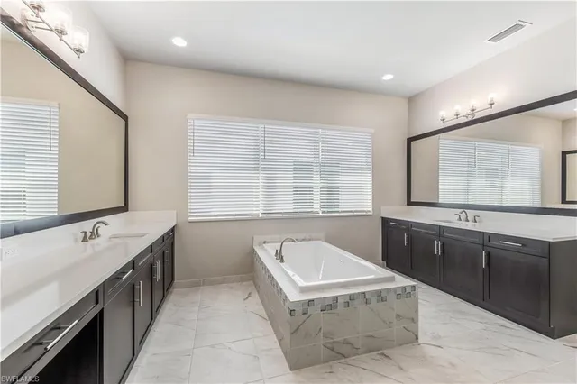 a bathroom with a shower and a sink