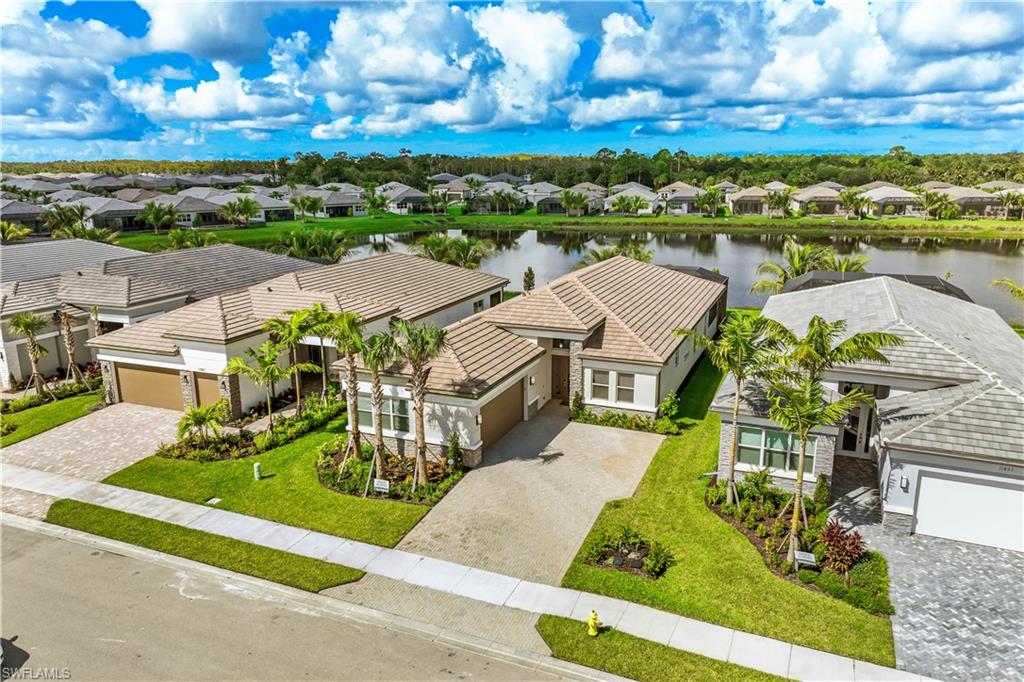 11847 Hydrangea Place Naples, FL 34120 - Photo 23 of 30 an aerial view of residential houses with outdoor space and ocean view