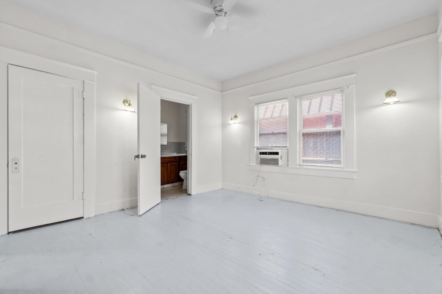 4354 East Kings Canyon Road Fresno, CA 93702 - Photo 25 of 87 a view of an empty room with a window and a kitchen