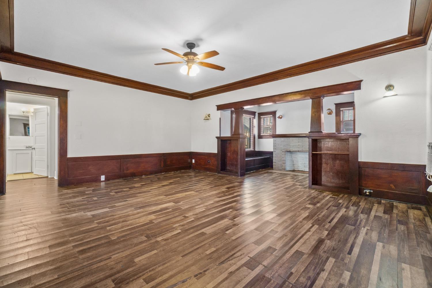 4354 East Kings Canyon Road Fresno, CA 93702 - Photo 33 of 87 a view of kitchen and empty room with wooden floor