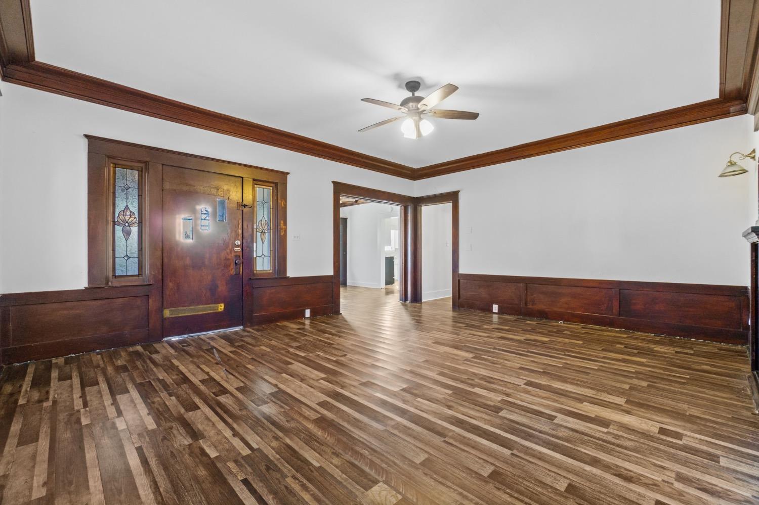 4354 East Kings Canyon Road Fresno, CA 93702 - Photo 34 of 87 a view of an empty room with wooden floor and fan