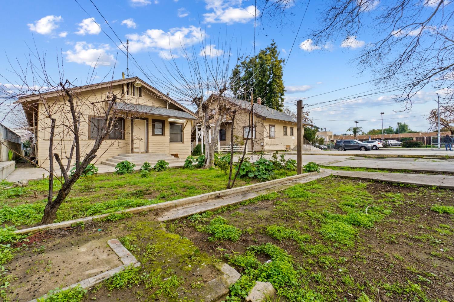 4354 East Kings Canyon Road Fresno, CA 93702 - Photo 74 of 87 a front view of a house with garden