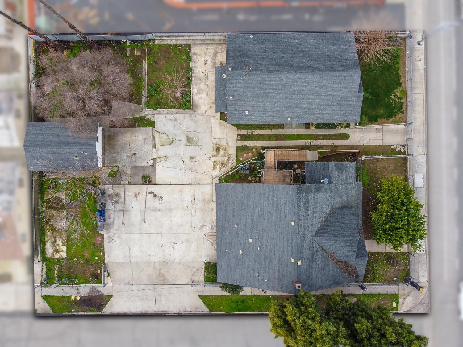 4354 East Kings Canyon Road Fresno, CA 93702 - Photo 84 of 87 an aerial view of residential houses with outdoor space and parking