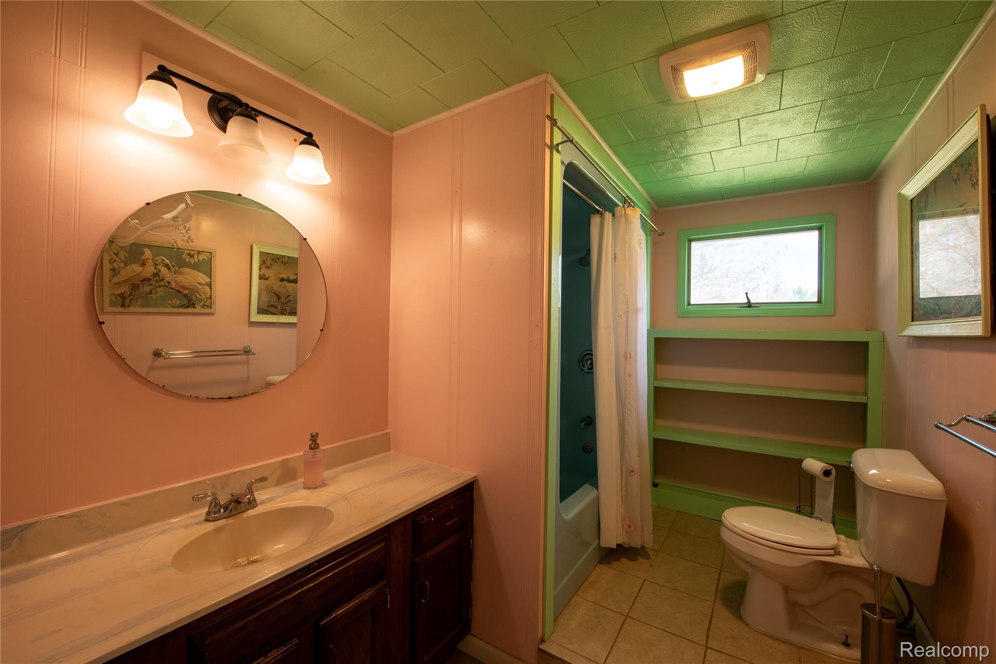 1190 Meadow Road Tawas City, MI 48763 - Photo 18 of 26 Bathroom with shower / tub combo with curtain, vanity, and light tile patterned floors