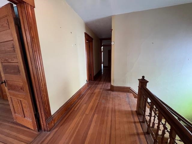642 West Stephenson Street Freeport, IL 61032 - Photo 19 of 38 a view of a hallway with wooden floor and stairs