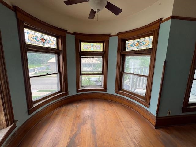 642 West Stephenson Street Freeport, IL 61032 - Photo 22 of 38 an empty room with wooden floor and windows