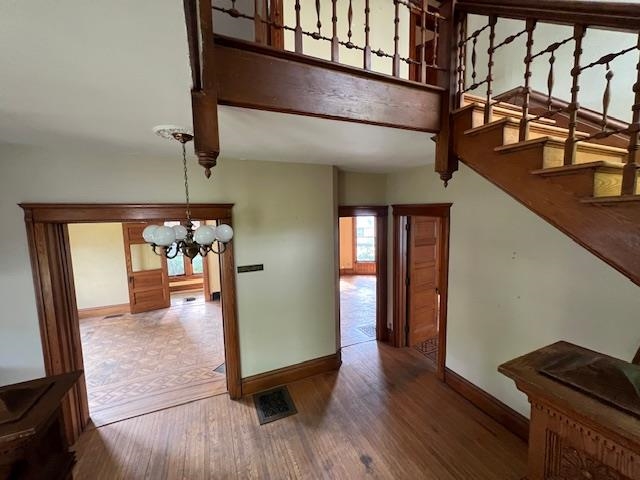 642 West Stephenson Street Freeport, IL 61032 - Photo 28 of 38 a view of a hallway with wooden floor and furniture