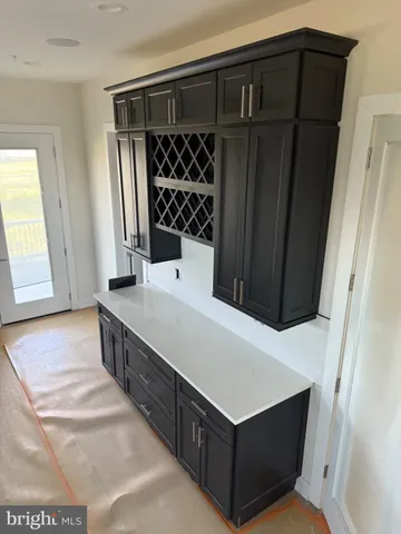 a kitchen with stainless steel appliances a refrigerator and a sink