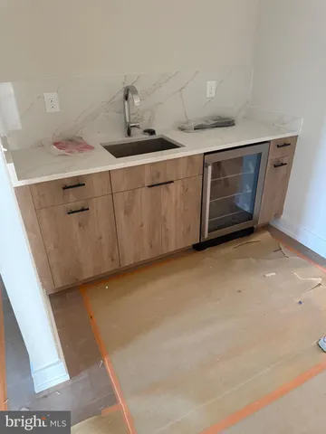 a view of a kitchen with a sink and dishwasher