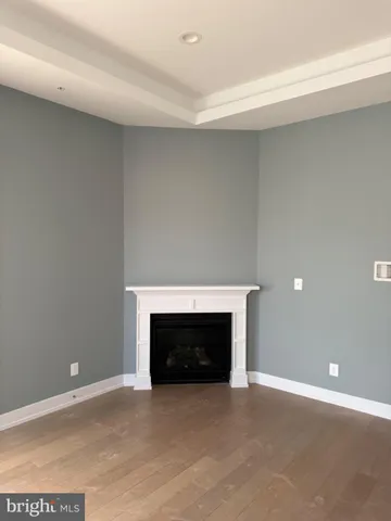 a view of empty room with a fireplace