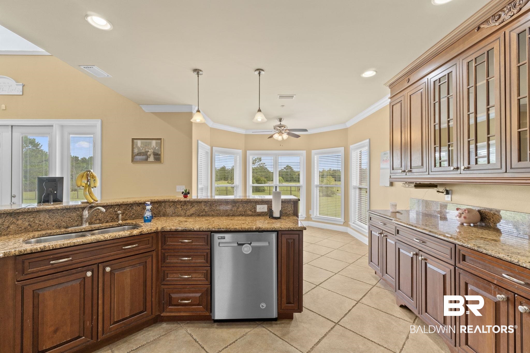 9790 Stucki Road Elberta, AL 36530 - Photo 41 of 72 Kitchen featuring dishwasher, light tile patterned floors, a sink, ceiling fan, and decorative light fixtures