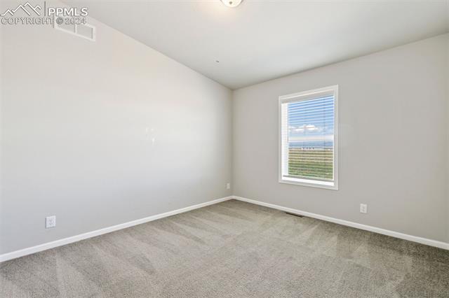 5929 North Log Road Calhan, CO 80808 - Photo 25 of 41 Secondary Bedroom with carpeted floors.