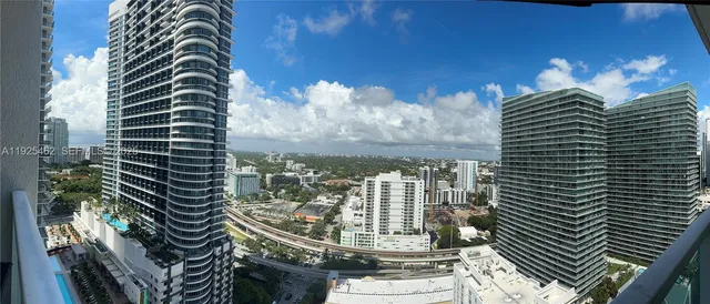 a view of a balcony with next to a city view
