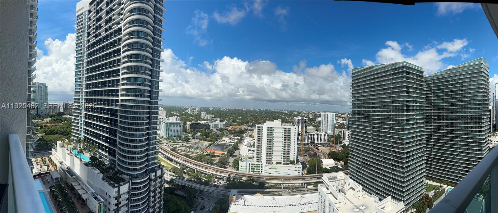 a view of a balcony with next to a city view