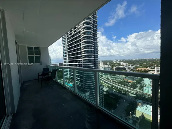 a view of balcony with furniture