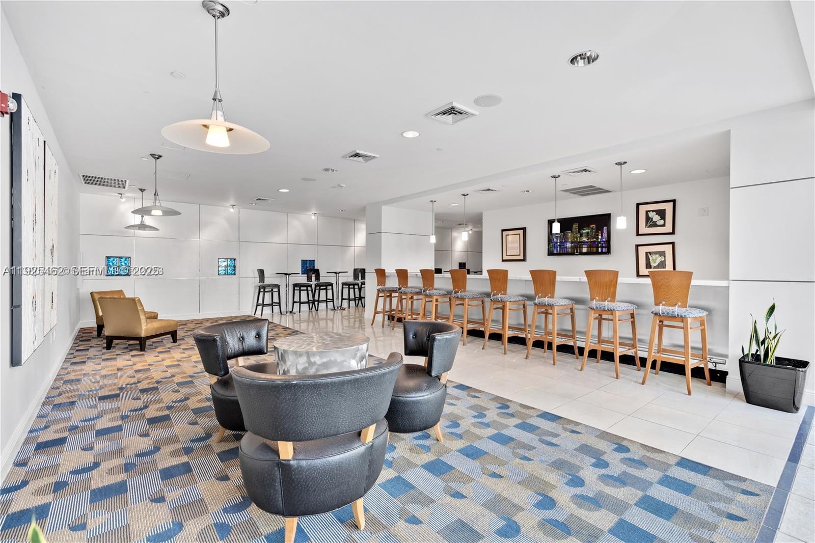 1250 South Miami Avenue, Unit 2805 Miami, FL 33130 - Photo 26 of 30 a dining room with lots of tables and chairs