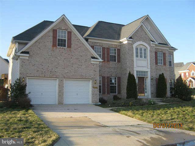 3406 Kidder Road Clinton, MD 20735 - Photo 1 of 26 a front view of a house with a yard and garage