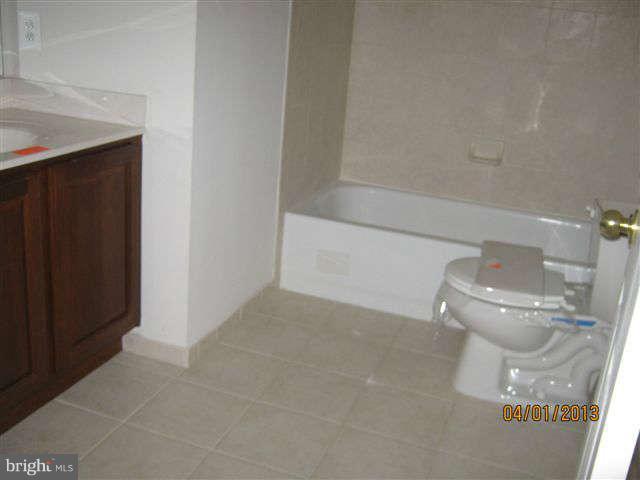 3406 Kidder Road Clinton, MD 20735 - Photo 18 of 26 a bathroom with a toilet and a shower