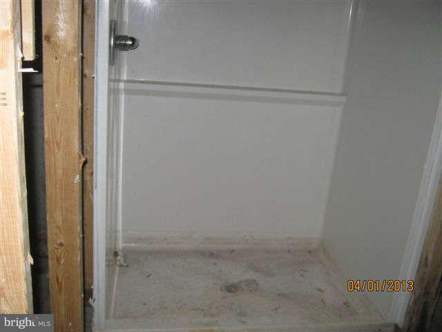 3406 Kidder Road Clinton, MD 20735 - Photo 22 of 26 a bathroom with a glass shower door