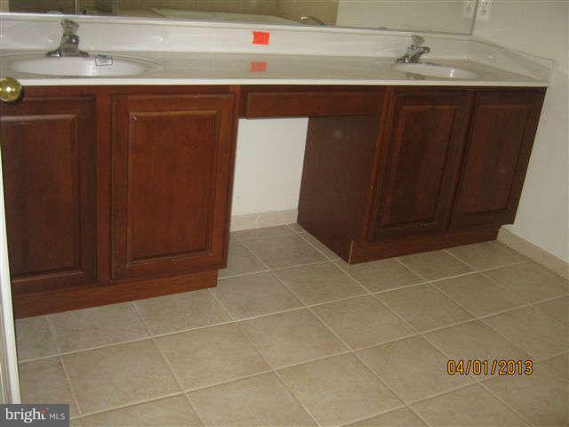 3406 Kidder Road Clinton, MD 20735 - Photo 26 of 26 a bathroom with a sink and a mirror