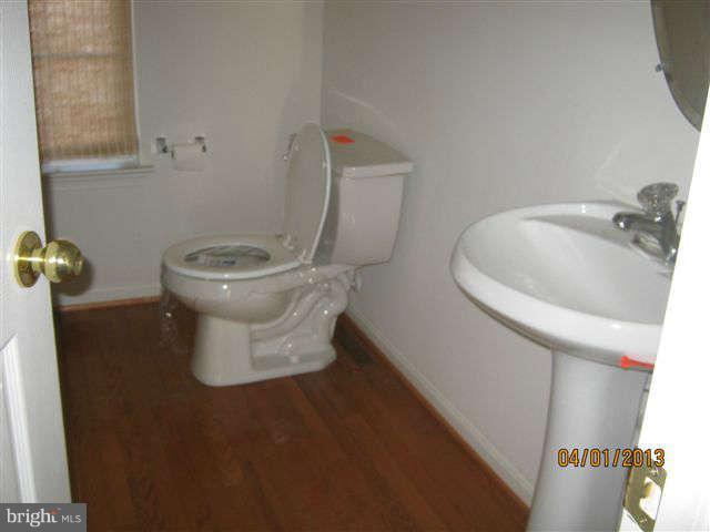 3406 Kidder Road Clinton, MD 20735 - Photo 9 of 26 a white toilet sitting next to a sink