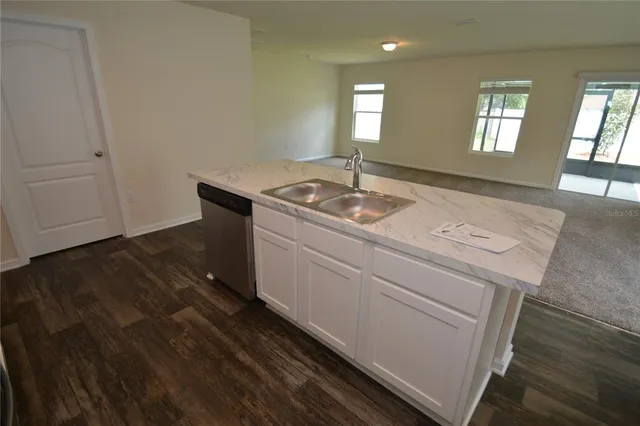 a utility room with faucet washer and dryer