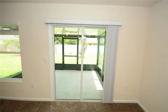 a front view of a building with palm trees