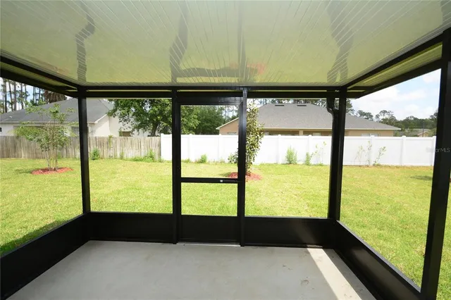 a view of a swimming pool and lounge chairs