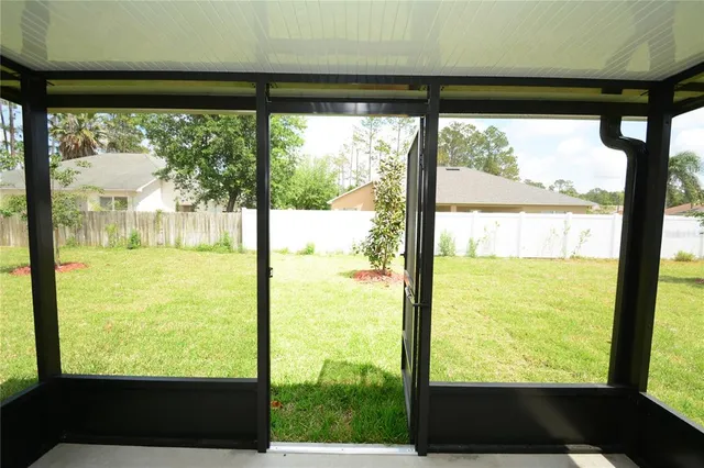 a view of a swimming pool with lounge chairs