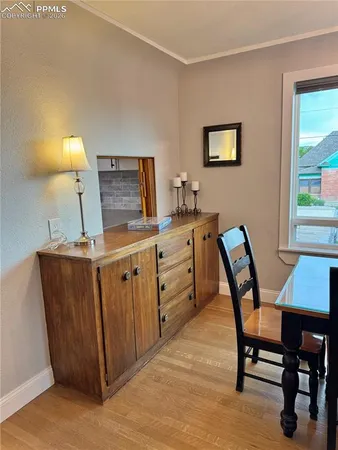 a kitchen that has a table and chair in it