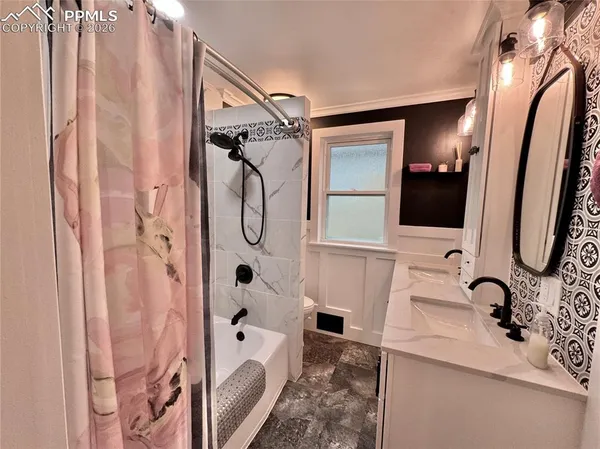 a bathroom with a sink and mirror