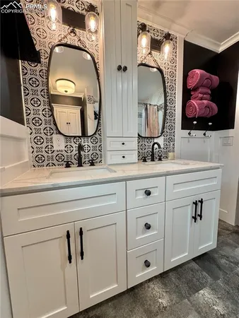 a bathroom with a double vanity sink and mirror