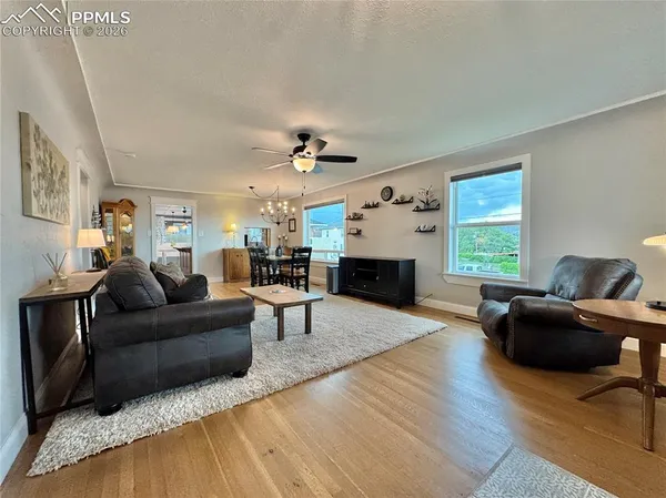 a living room with furniture and a fireplace