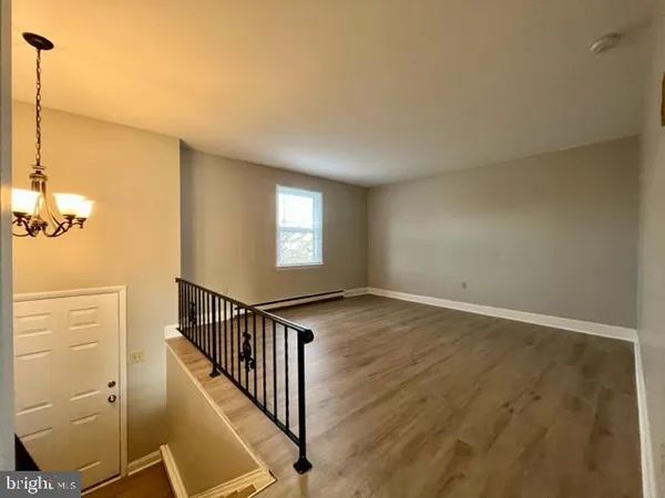 a view of a livingroom with wooden floor