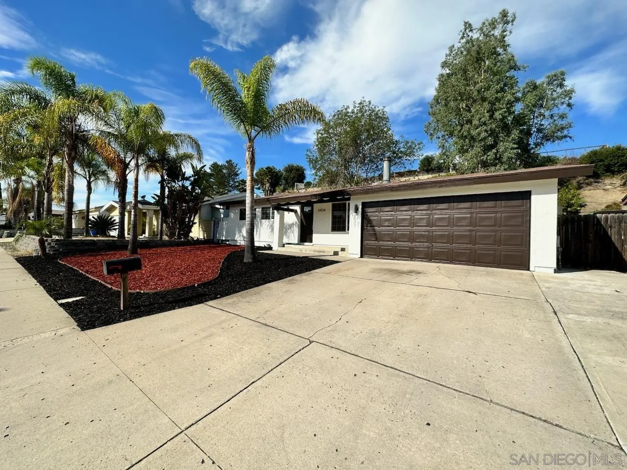 13534 Mountainside Drive Poway, CA 92064 - Photo 1 of 9 a view of backyard with outdoor seating and plants