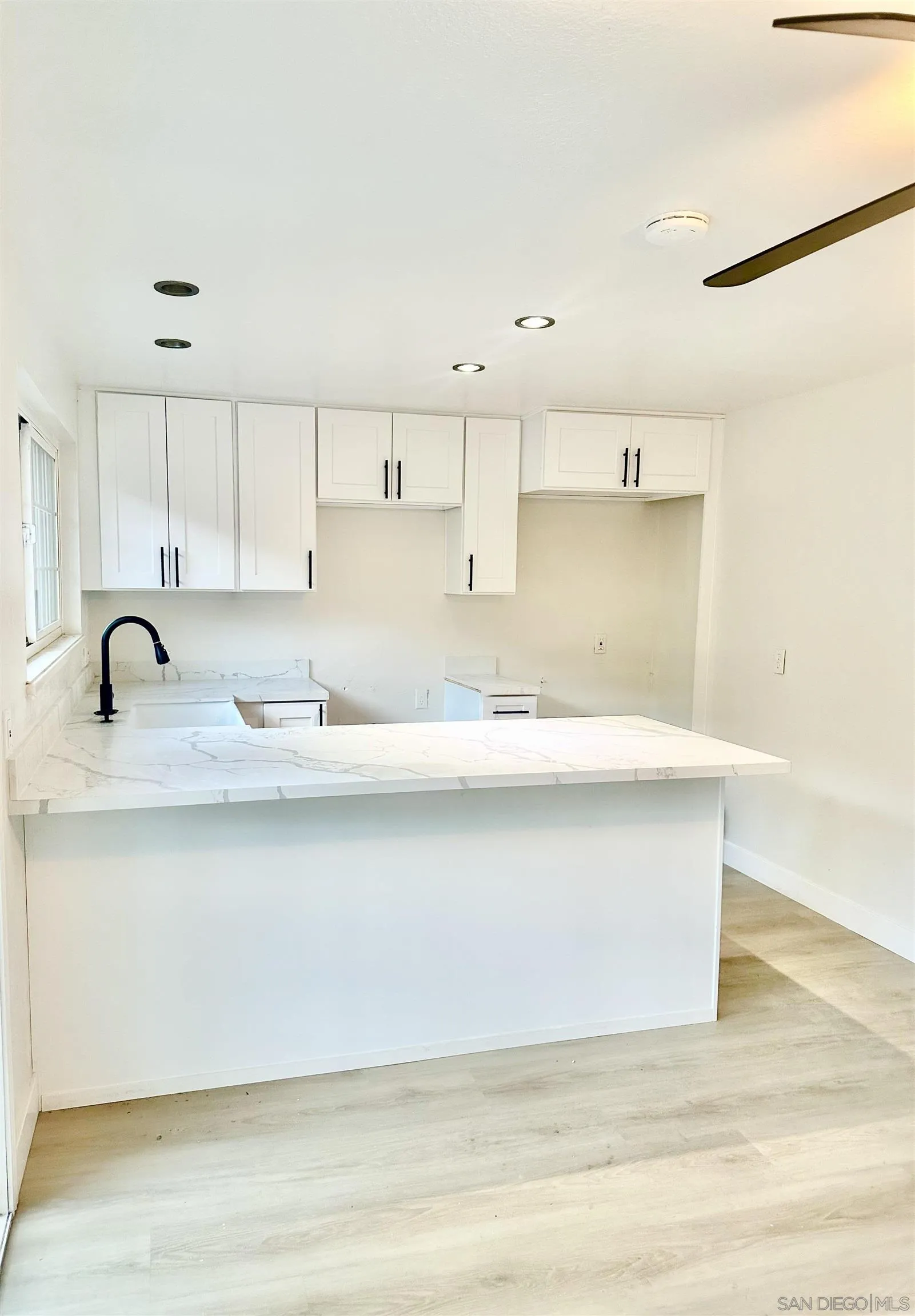 13534 Mountainside Drive Poway, CA 92064 - Photo 2 of 9 a bathroom with a sink and a mirror