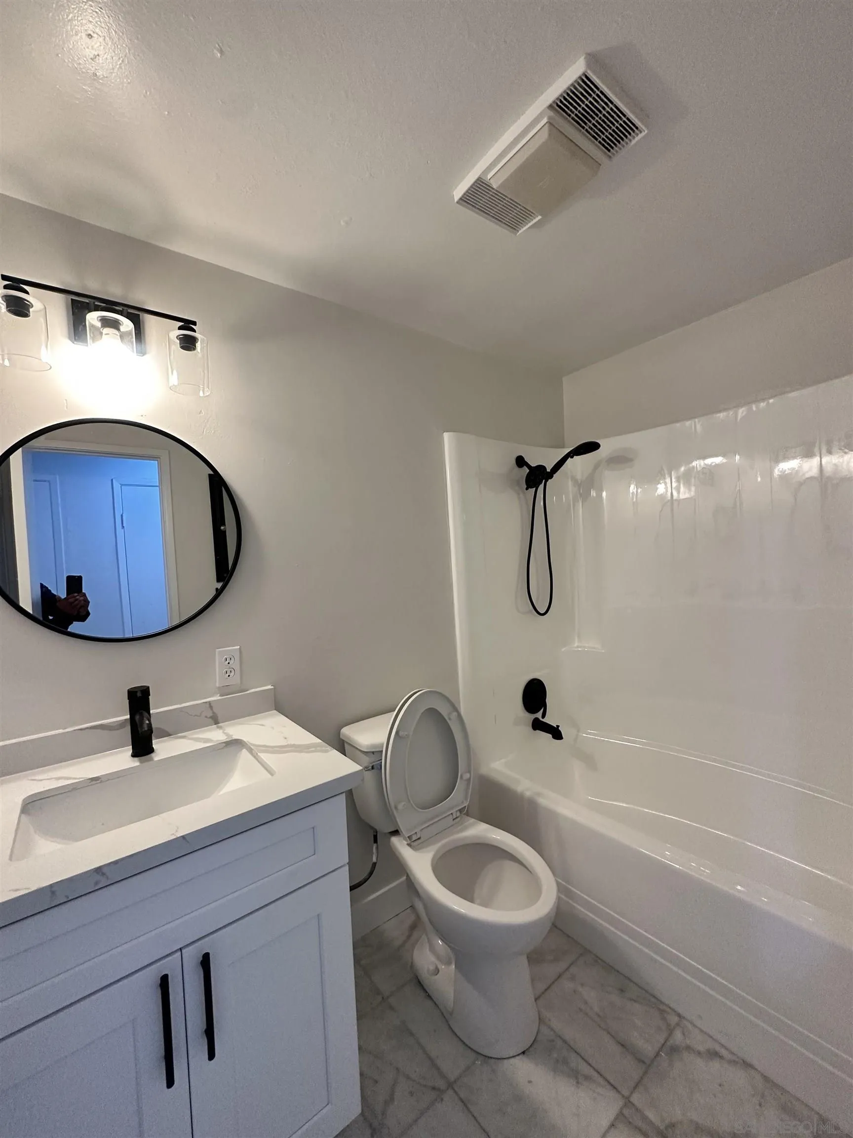 13534 Mountainside Drive Poway, CA 92064 - Photo 8 of 9 a bathroom with a sink a toilet and shower