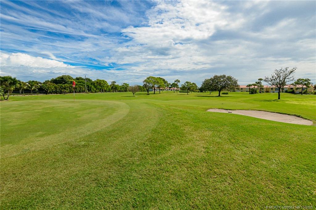 5373 Southeast Miles Grant Road, Unit C102 Stuart, FL 34997 - Photo 4 of 21 a view of an ocean from a yard