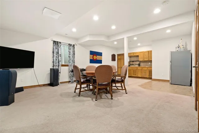 a view of a livingroom with furniture and a flat screen tv