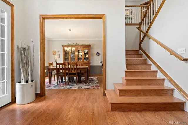 a view of entryway and hall with wooden floor