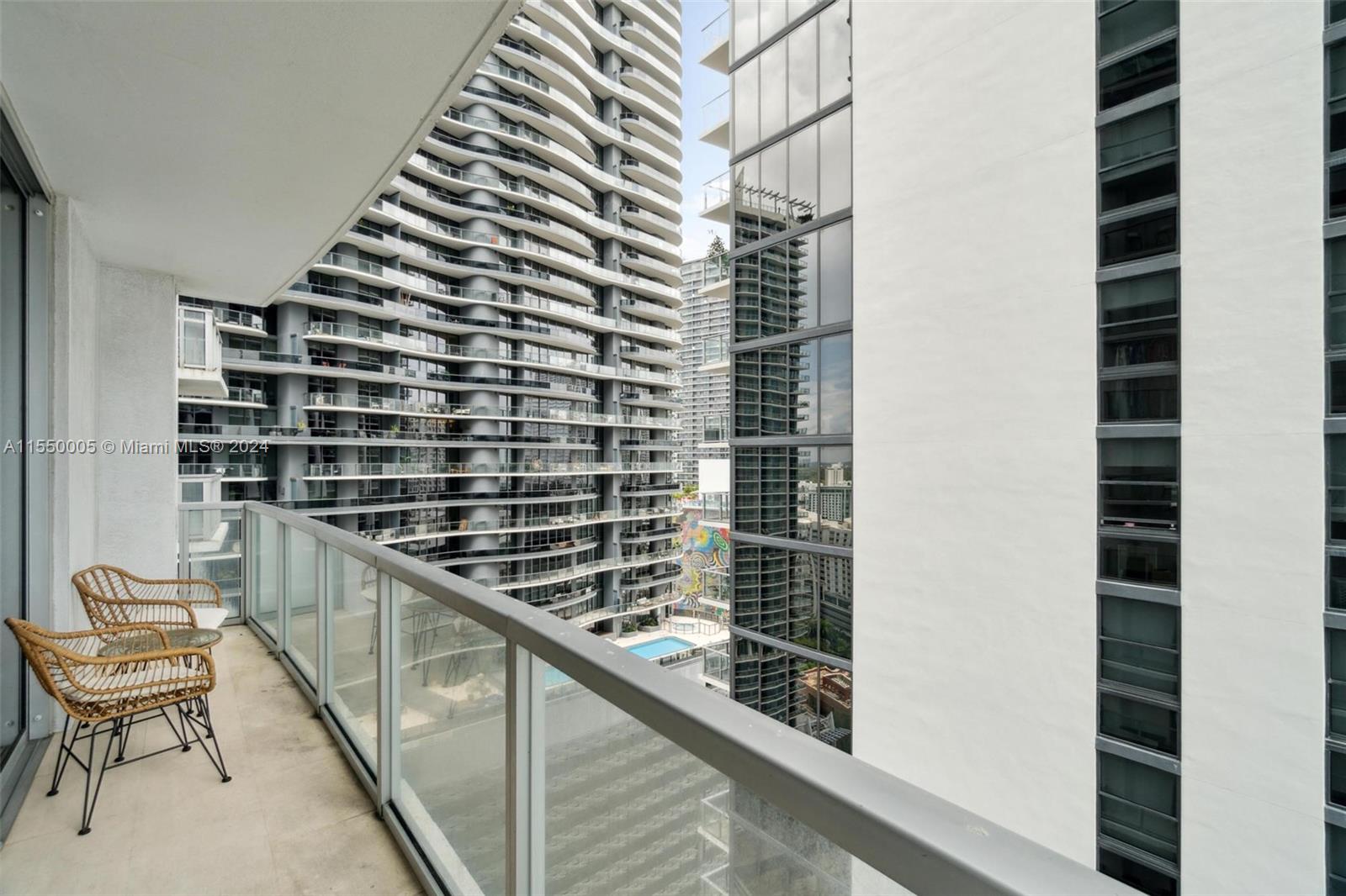 1050 Brickell Avenue, Unit 2422 Miami, FL 33131 - Photo 15 of 21 a balcony with a bench