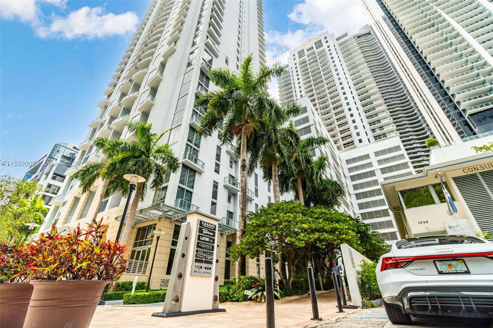 1050 Brickell Avenue, Unit 2422 Miami, FL 33131 - Photo 19 of 21 a view of a street with palm trees