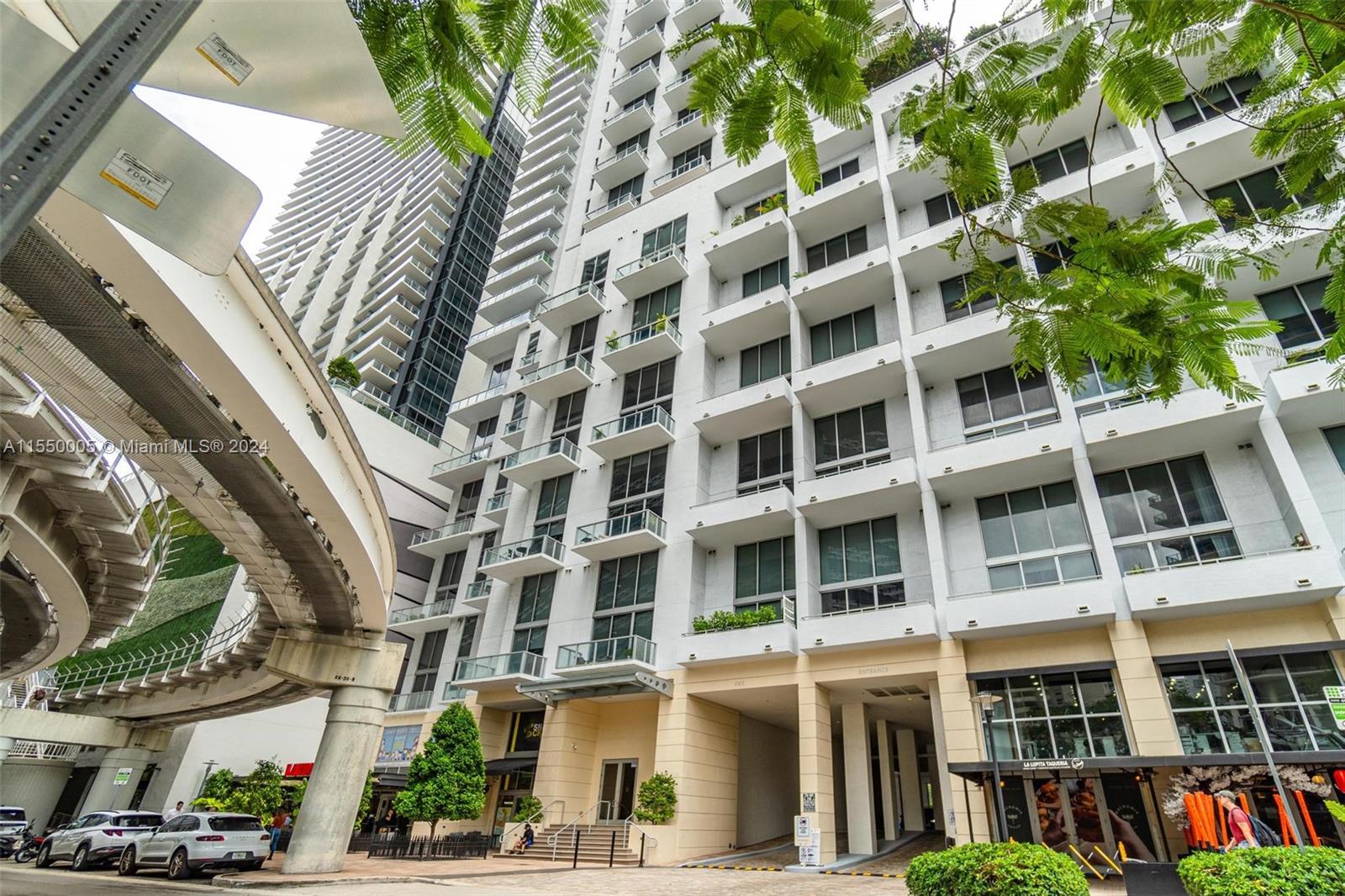 1050 Brickell Avenue, Unit 2422 Miami, FL 33131 - Photo 20 of 21 a front view of a multi story building with yard