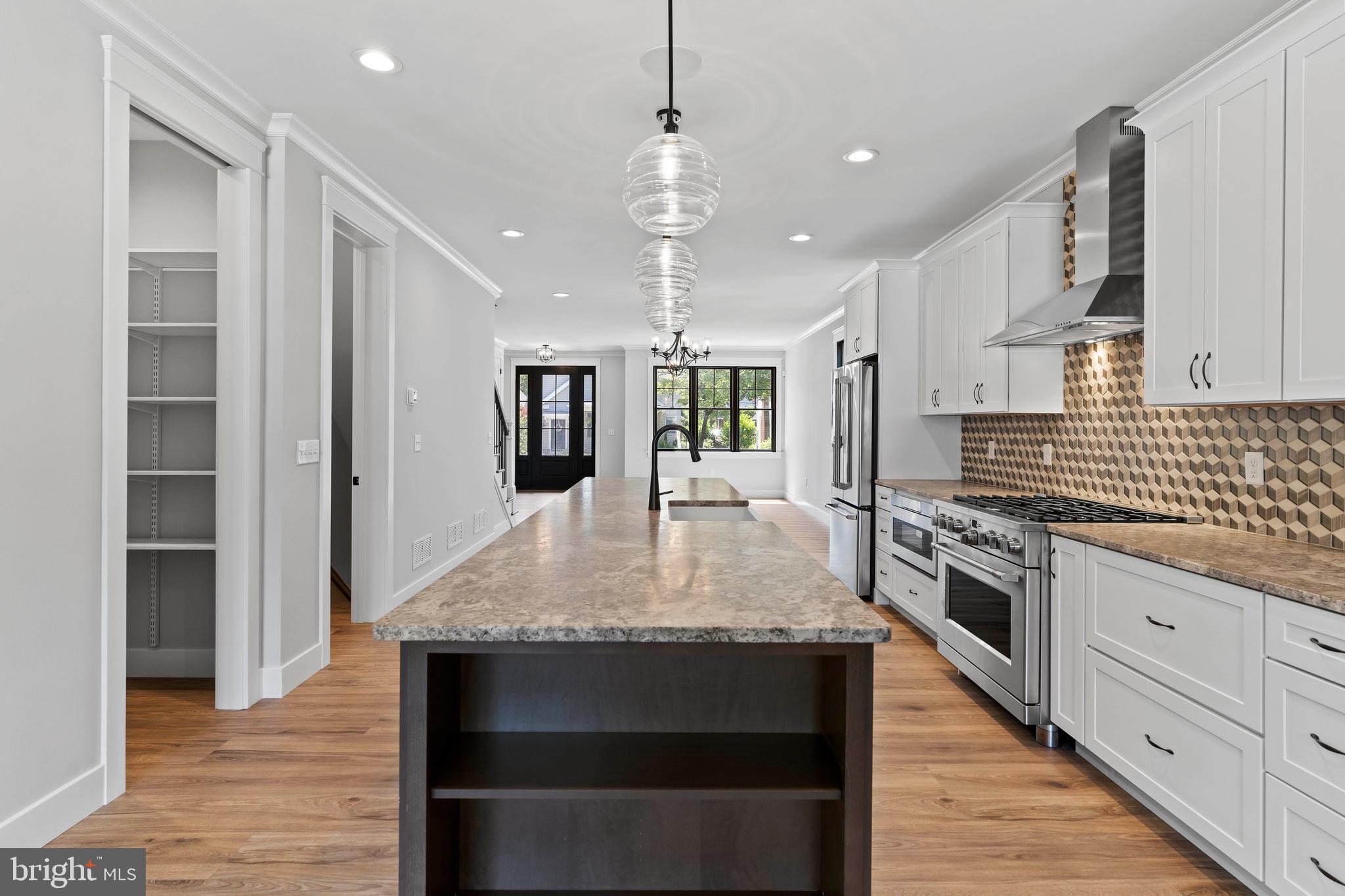 207 Maple Avenue Hershey, PA 17033 - Photo 13 of 79 a large kitchen with granite countertop a stove refrigerator and cabinets