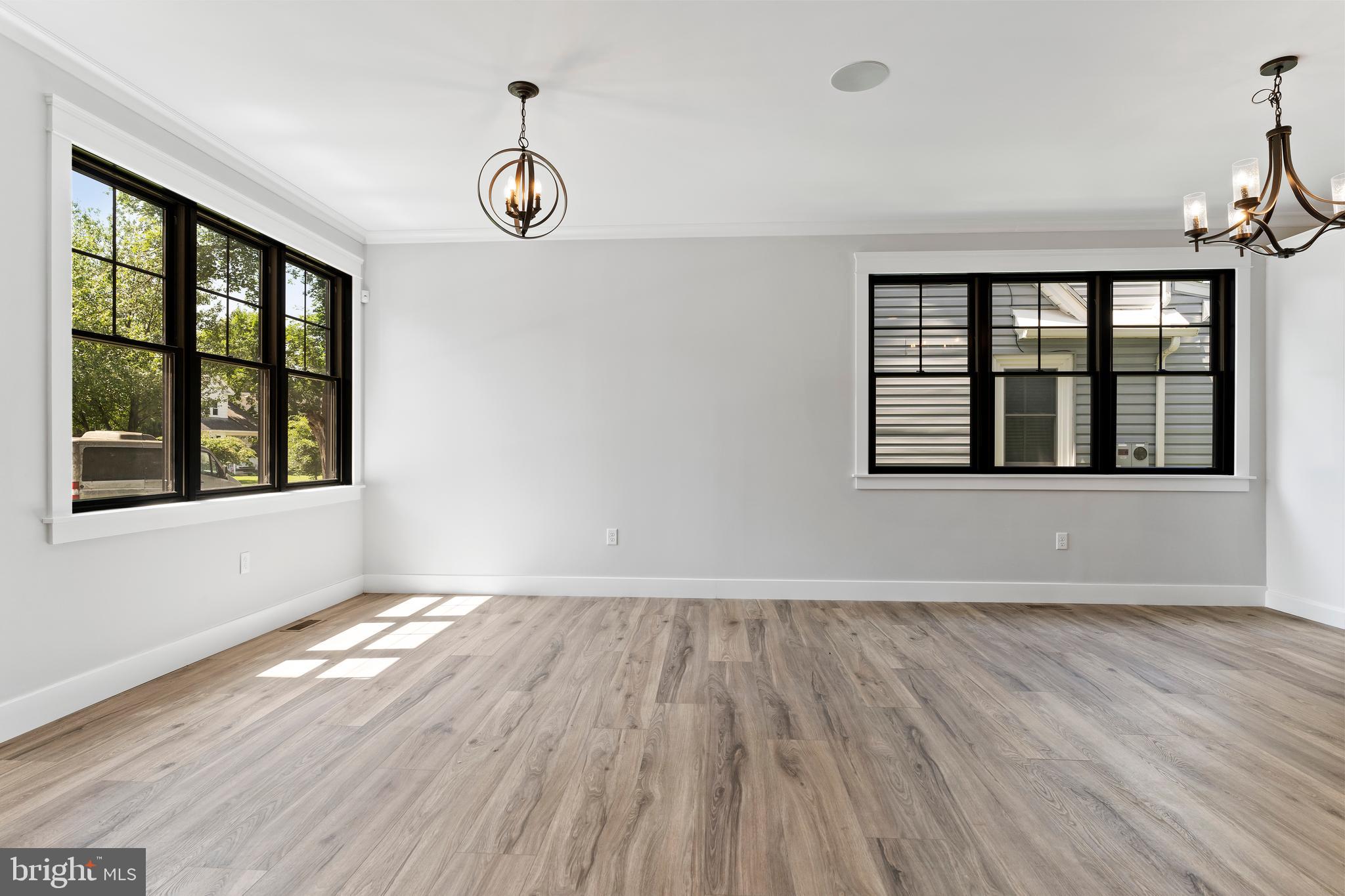 207 Maple Avenue Hershey, PA 17033 - Photo 19 of 79 a view of an empty room with wooden floor and a window