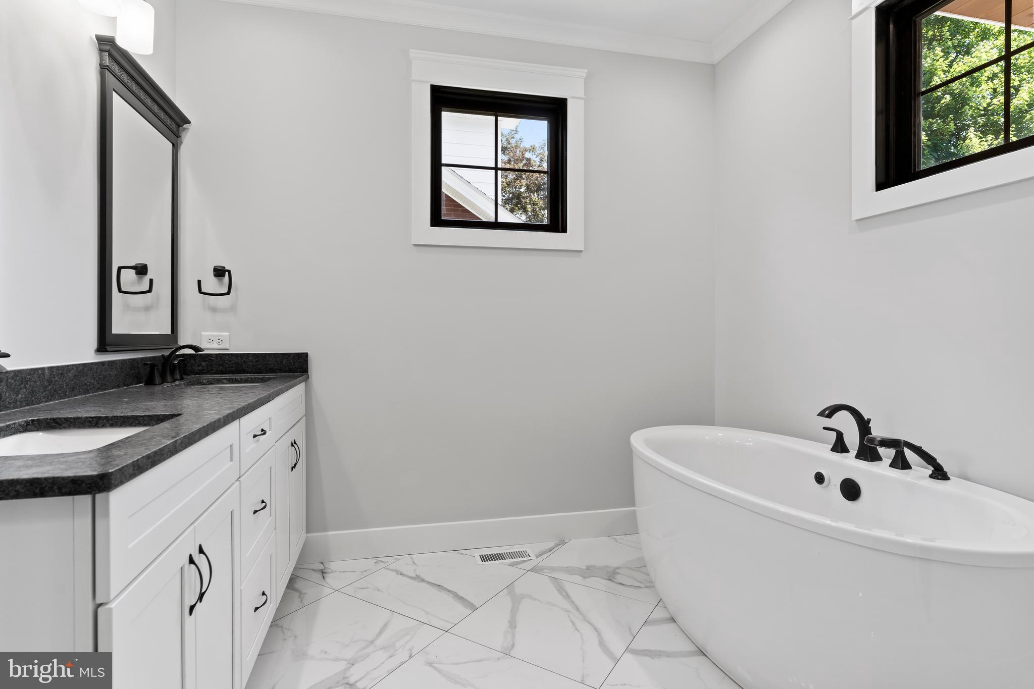 207 Maple Avenue Hershey, PA 17033 - Photo 21 of 79 a bathroom with a granite countertop sink and a mirror