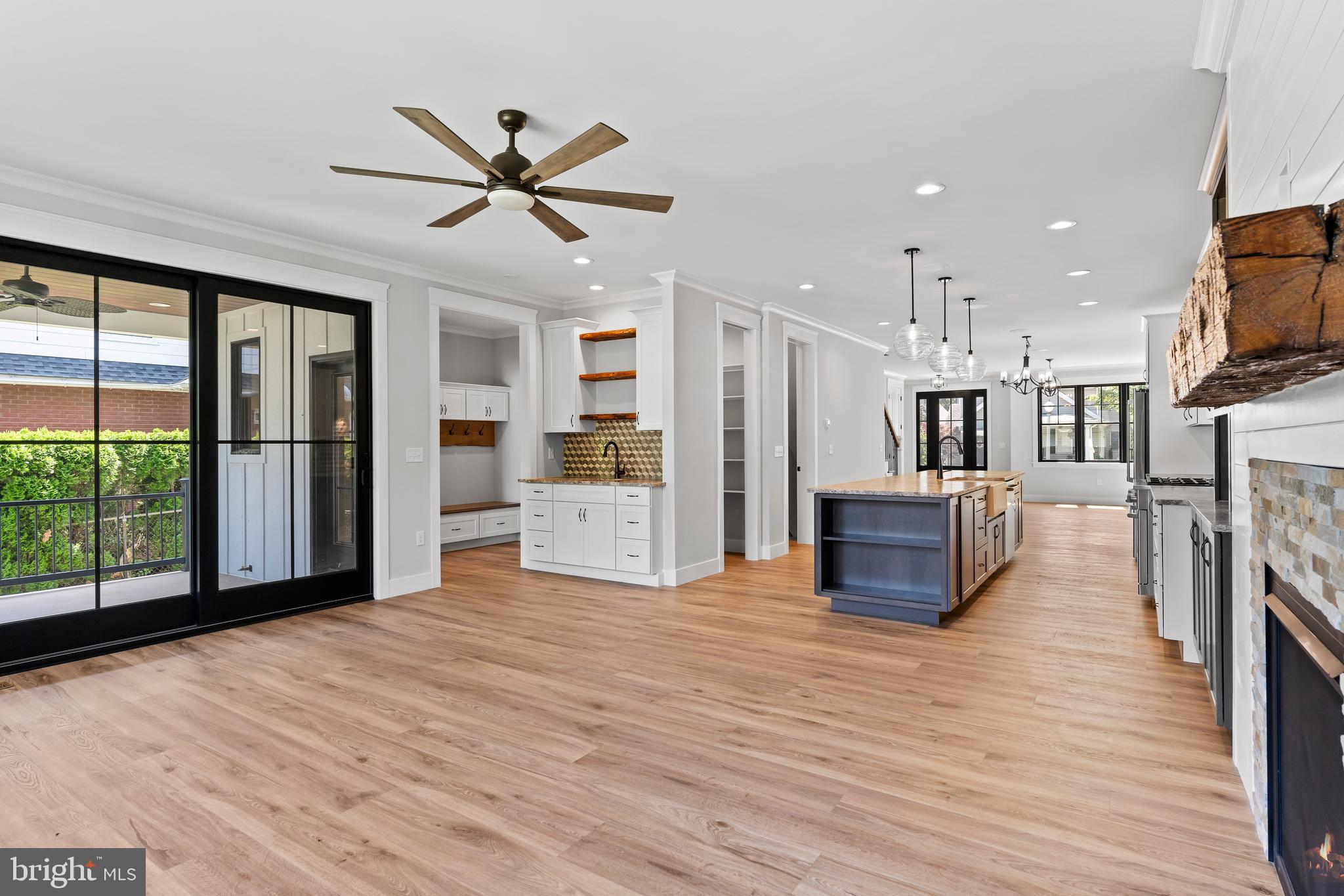 207 Maple Avenue Hershey, PA 17033 - Photo 24 of 79 a view of a kitchen with furniture a ceiling fan and wooden floor